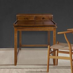 a wooden desk with a chair next to it