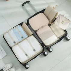 four pieces of luggage sitting on the floor