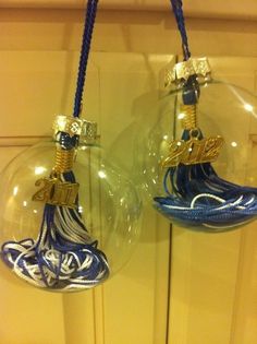 two glass ornaments hanging from a door