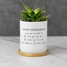 a potted plant with a happy retirement poem on it's side sitting on a marble surface