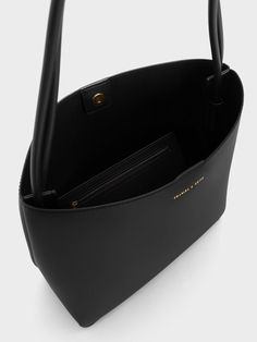 Black Leia Tote Bag | CHARLES & KEITH Modern Everyday Recyclable Bags, Modern Recyclable Bags For Everyday Use, Modern Rectangular Recyclable Bag, Eco-friendly Everyday Double Handle Bucket Bag, Eco-friendly Everyday Bucket Bag With Top Handle, Modern Recyclable Shoulder Bag For Shopping, Modern Recyclable Tote Bag, Charles And Keith Tote Bag, Eco-friendly Top Handle Bucket Bag For Everyday Use