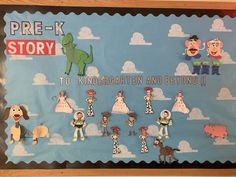 a bulletin board with pictures of children's characters in the sky and farm animals on it