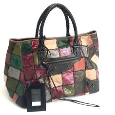 Authentic Balenciaga Arena Patchwork Tote. Balenciaga Multi-Color Leather Patchwork "Arena" Bag. Has Black Leather Contrast Stitching Throughout Patchwork Made In Italy Multi-Colored Calf Skin Leather Hardware: Gunmetal Materials: Leather And Metal Lining: Brown Leather And Black Canvas In Mint Condition Closure:Open Top With Hidden Magnetic Closure Exterior Pockets: One Front Zipper Pocket Interior Pockets: One Zipper Pocket Serial Number: 228755 002123 Retails For Around $2,999 Overall Condition Is Excellent. Exterior Condition Is Excellent, The Distressed Leather Is Intentional. Interior Is In Mint Condition Includes A Small Mirror 22"W X 12.5"H X 10.5"D Handle Drop: 5" Bags Balenciaga, Balenciaga Arena, Small Mirror, Leather Patchwork, Leather Hardware, Patchwork Bags, Small Mirrors, Colored Leather, Distressed Leather