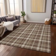 a living room with a couch, chair and rug