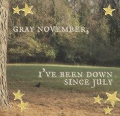 the words gray november, i've been down since july are written in gold stars