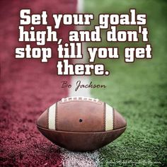 a football sitting on top of a field with the words set your goals high and don't stop til you get there