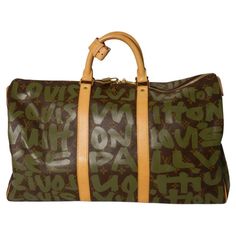 Louis Vuitton Keepall 50 Stephen Sprouse Monogram Graffiti in Khaki and Green. The bag is in very good condition, llightly used. There is a small spot on the poignet and some light marks on the leather straps on the bottom but there don't seem to be any other flaws. We've done our best to show the condition with the detail photos. The bag comes with the poignet and lock and keys. Date Code/Serial Number: FL0051 Made In: France Measurements: Length: 20" Width: 8.5" Height: 11.5" Handle Drop: 4" Stephen Sprouse, Louis Vuitton Keepall 50, Louis Vuitton Keepall, Khaki Green, Fashion Handbags, Purses Crossbody, Made In France, Leather Straps, Graffiti