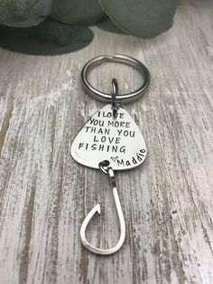 a keychain with a fishing hook attached to it