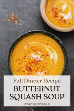 two bowls filled with butternut squash soup on top of a black counter next to a white sign that says fall dinner recipe