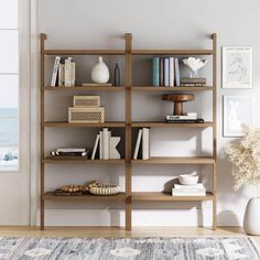 The Beacon 5 tier bookshelf (set of 2) is not just any wooden bookshelf - it's a boho masterpiece that combines rustic charm with practical design. Your eyes will be drawn to a stunning wire brushed finish that instantly adds a touch of warmth and style to your home office or living room. The solid wood frame not only ensures durability but also brings a sense of timeless elegance. You know this piece is built to last The Beacon bookcase features 5 spacious tiers, perfect for everything from your favorite novels to quirky collectibles. Each shelf panel is constructed with high quality MDF wrapped in real wood veneer to make sure it's sturdy enough to handle your heaviest hardcovers. And no need to worry about tipping -- it's designed to be mounted on your wall easily, making it as stable a 5 Tier Bookshelf, Solid Wood Bookshelf, Bookshelf Table, Bookshelf Lighting, Home Library Rooms, Wood Bookshelf, Wooden Bookshelf, Nathan James, Wood Bookshelves