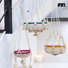 two hanging baskets with rope on the ceiling