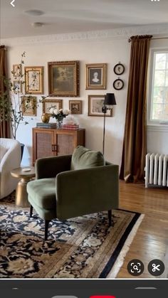 a living room filled with furniture and pictures on the wall