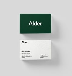 a business card with the name alder written in white and green ink on it