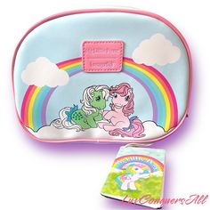 This Loungefly Retro Artwork Of My Little Pony, Set Features Three Makeup Bags, Each Sporting Nostalgic, Dreamy Designs. The Largest One Shows Off Four Ponies Roaming The Clouds, Surrounding A Clear Window That Reveals The Allover Print Inside! Pvc; Polyurethane Large Bag Approx. 9" W X 7" H X 2 1/2" D; Medium Bag Approx. 7 1/2" W X 6" H; Small Bag Approx. 6" W X 5" H New ***Firm Price*** My Little Pony Makeup, Pony Makeup, Makeup Bag Set, Retro Artwork, Loungefly Bag, Barbie Stuff, Clear Windows, Medium Bag, Clear Window