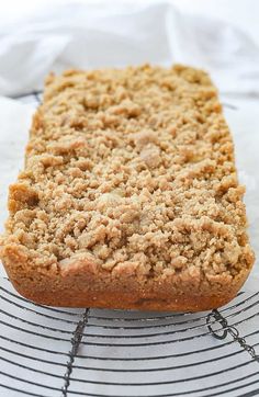 a loaf of bread sitting on top of a cooling rack