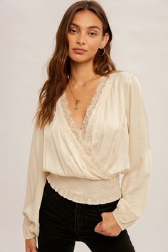 This Amir Blouse is ready to make some serious fashion waves! Crafted from a blend of rayon and polyester, the surplice lace-trimmed smock waist blouse is sure to add a classy and luxe touch to any outfit. Give your wardrobe an upgrade with this must-have piece! Lace Trim Blouse, Swim Cover Up Dress, Style Steal, Crop Top Tees, Plus Size Sweaters, Satin Blouse, Style Mistakes, Fashion Fits, Blouse Fabric