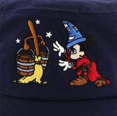 a mickey mouse hat with a cartoon character on it