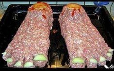 two large pieces of meat sitting on top of a pan