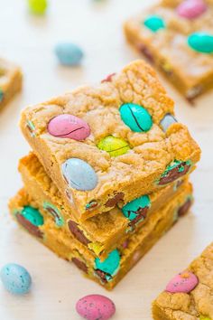 several cookies and candy bars stacked on top of each other with easter eggs in the middle