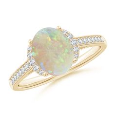 An oval opal draws the eye with its fascinating color play. Set in 14K yellow gold, the center stone is flanked by trios of glittering diamond accents. Additional diamonds adorn the shank, lending added sparkle to this classic opal ring. 14th Wedding Anniversary, Diamond Collar, Color Play, Diamond Glitter, Play Set, Opal Ring, Classic Ring, Opal Rings, 18k Rose Gold