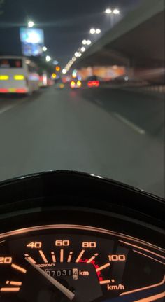 the dashboard of a car on a highway at night