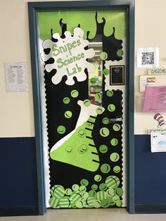 a classroom door decorated with green and white items that say shoes science lab on it