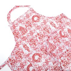 an apron with red and white designs on it