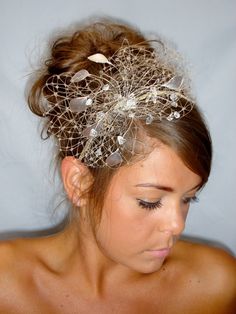 a woman wearing a hair comb with flowers on it