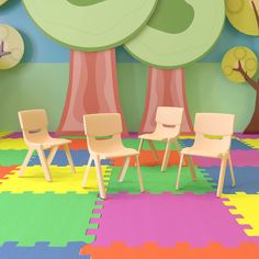 there are four chairs in the room with colorful rugs on the floor and trees painted on the wall