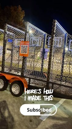 an orange trailer parked in front of a fence with the words here's how i make this subbed