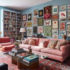 a living room filled with furniture and lots of pictures on the wall