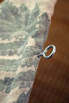 a piece of fabric with a metal ring on it