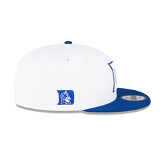 The Duke Blue Devils White 9FIFTY Snapback features an embroidered Blue Devils logo at the front with an alternate team logo at the right-wear side. Additional details include a snapback closure at the rear and a gray undervisor. Functional Blue Snapback Hat, Classic Blue Snapback Hat, Blue Snapback Fitted Hat For Game Day, Blue Devils Logo, Duke Blue Devils Logo, Collegiate Blue Snapback Hat, Duke Blue Devils, Blue Devil, New Era Cap