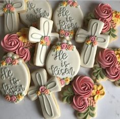 decorated cookies with the words he is risen and flowers on them are arranged in rows