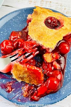 a piece of cherry pie on a blue plate