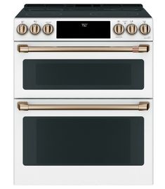 two white ovens side by side with gold knobs on the top and bottom