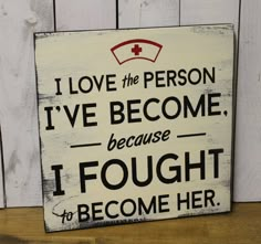 a sign that says i love the person i've become because i fought to become her