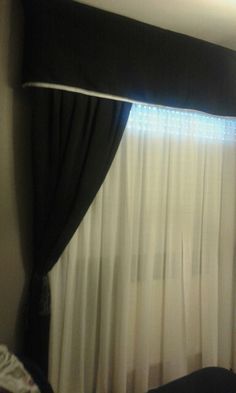 there is a black and white curtain in the room