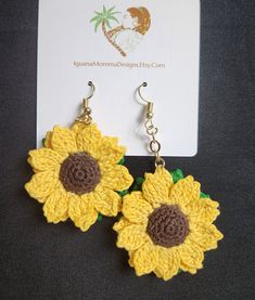 Lift your spirits with a Pair of Sunflower earrings, two rows of flowers with a green leaf to finish the back. Brighter days ahead! A lightweight and playful dangle from the earlobe keeps them dancing in your ears, framed by short or long hair. Sunflower Dangle Earrings For Summer, Green Flower-shaped Earrings For Summer, Handmade Flower Dangle Jewelry For Summer, Summer Sunflower Dangle Earrings, Cute Green Flower-shaped Earrings, Hypoallergenic Green Flower Earrings, Summer Flower Earrings With Sunflower Design, Summer Green Flower Earrings With Ear Wire, Summer Sunflower Design Flower Earrings