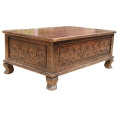 Add art to your home with the New Delhi Elephant Hand Carved Rustic Solid Wood Storage Coffee Table Chest. This versatile piece can be used as a storage box and accent table. This intricately hand carved trunk is made of Mango wood and features an rustic stain. The large decorative chest has elephants marching along the sides and a diamond pattern on top. Special Features: Interior completely finished. Short cabriole legs. Hand carved designs throughout piece. Oak stain individually mixed and ap Coffee Table Chest, Wood Elephant, Trunk Chest, Coffee Table Furniture, Unique Living Room, Indian Furniture, Chest Coffee Table, Large Coffee Tables, Elephant Decor