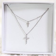 The Double Cross Necklace is such a dainty and pretty piece of jewelry. With it's fragile yet classy look.  925 Sterling Silver Highest Grade CZ stones Water & Tarnish Resistant Hypoallergenic Elegant Silver Hypoallergenic Necklaces, Elegant Hypoallergenic Silver Necklaces, Minimalist Silver Cubic Zirconia Jewelry, Elegant Silver Necklace With Cross Pendant, Elegant Silver Cross Pendant Necklace, Elegant Clavicle Chain With Cross Pendant, Elegant Clavicle Chain Jewelry With Cross Pendant, Elegant Clavicle Chain With Cross Pendant Jewelry, White Gold Double Strand Jewelry For Anniversary