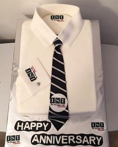 a white shirt and tie with happy anniversary stickers on it's packaging box