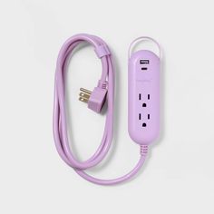 a purple power strip plugged into an extension cord