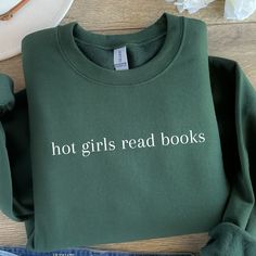 Hot Girls Read Books Heavy Blend Crewneck Sweatshirt/ Book Sweatshirts/ Book Lover Gifts/ Bookworm Gifts/ Bookish Sweatshirts/Sweatshirt PLEASE READ : please note that the darker sweatshirt colors will have white font instead of black for you to see the text better!! (unless requesting otherwise) Elevate your bookish style with our "Hot Girls Read Books" crewneck sweatshirt! This sassy and empowering sweatshirt is designed for the confident bookworm who knows that brains and books are the ultimate combination. Whether you're hitting the library, browsing a bookstore, or simply snuggling up with a great read, this crewneck sweatshirt is your perfect literary companion. - made with 50% polyester, 50% cotton fabric blend 🎁 Gift:  Searching for the ideal gift for your fellow bookworm or a fie Book Club Sweatshirt, Book Worms Aesthetic Outfit, Book Apparel, Bookish Clothes, Book Crewneck, Book Sweatshirts, Bookish Sweatshirts, Bookworm Sweatshirt, Reading Sweatshirt