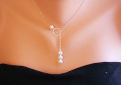 An elegant infinity lariat necklace with a three pearl pendant: 1. a 24k gold vermail infinity charm 2. four 8mm swarovski white (or ivory upon request) pearls, one just above the infinity charm, three dangled as a pendant 3. a 14k gold filled chain closed with a lobster clasp All 14k gold filled findings Packaged in my shop's premium quality gift box (as shown) Quantity discount available. Three Pearl Necklace, Infinity Necklace Gold, Wire Ideas, String Necklace, Pearl Lariat, Customizable Jewelry, Infinity Charm, Pearl Necklace Earrings, Gold Pearl Necklace