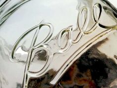 closeup of the hood ornament on a shiny chrome car's emblem