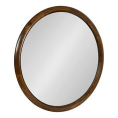 a round wooden mirror on a white background