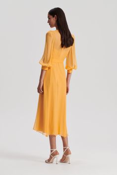 The Silk Georgette Dress imbued with sophisticated elegance. Crafted from 100% silk in a vibrant citrine hue, the sheer silhouette is designed with a high, rounded neckline, gathered shoulder detailing and front keyhole opening. Choose to style the dress with the self-belt for added shape through the waist and finish with refined accessories for a polished ensemble for upcoming occasions. Silk Georgette Dress, Silk T Shirt, Scanlan Theodore, Georgette Dress, Mid Length Sleeves, Leather Denim, Rounded Neckline, Australian Fashion, Crepe Dress