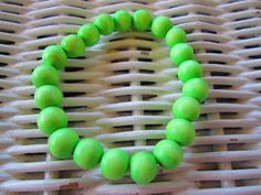 BUY ONE, GET ONE FREE This is a handmade beaded bracelet. The bracelet is made with 8mm  Lime Green wood beads strung on Elastoma Clear .8mm diameter Premium Quality Elastic Jewelry Cord. It comes in lengths from 5-10 inches...be sure to make your choice. This bracelet can be stacked with others. Elastic Jewelry, Wood Bead Bracelet, Green Wood, Buy One Get One Free, Wilmington Nc, Star Bracelet, Dec 8, Bracelets Handmade Beaded, Bead Stringing