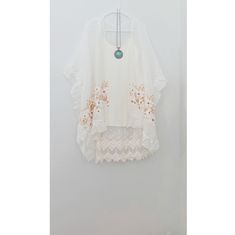 Lily Embroidered Kimono Ruffle Kimono Lily Flower Kimono Embroidered Floral Spring Summer Cover Up Embroidered Kimono with Lily embroidery and ruffle in mid-length hem. Light and breezy this kimono with generous volume to gracefully drape at the sides like a boho-chic kimono. One size fits most. *Due to lighting and differences in monitors, actual colors may vary slightly from what appears online. Shipping: We ship within 1-3 business days. Most of my items are ready to ship. All mails are shipp Flowy Embroidered White Tops, Flowy White Embroidered Top, Flowy Floral Embroidered Beach Blouse, Flowy Floral Embroidered Blouse For Beach, Summer Beach Embroidered Top With Lace Trim, Summer Beach Embroidered Top With Chikankari, White Embroidered Top With Chikankari For Summer, White Chikankari Embroidered Top For Beach, White Floral Embroidered Beach Blouse